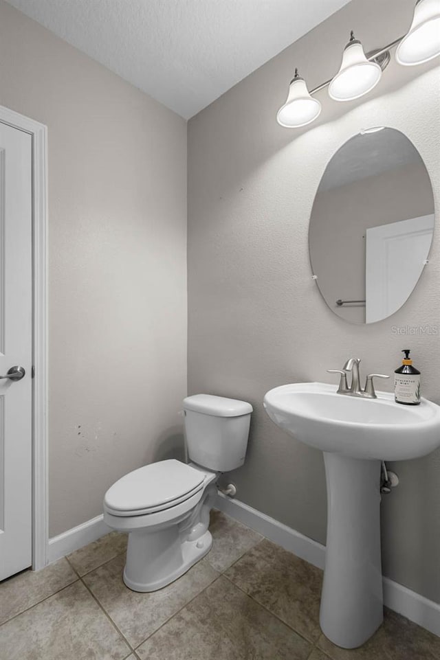 1821 Hawks View Dr, Ruskin, FL 33570 - half bathroom with tile patterned floors and a textured ceiling