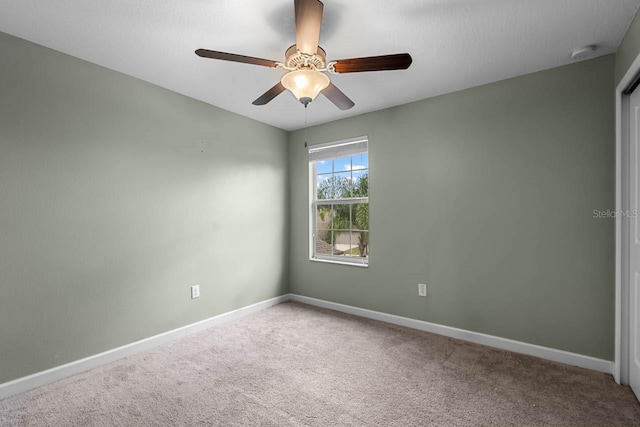 1821 Hawks View Dr, Ruskin, FL 33570 - carpeted empty room with a smoke detector and a ceiling fan