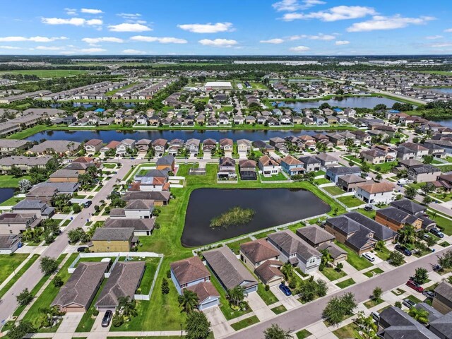1821 Hawks View Dr, Ruskin, FL 33570 - aerial view of property and surrounding area featuring a nearby body of water and nearby suburban area