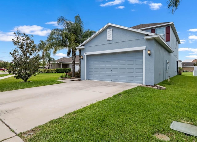 1821 Hawks View Dr, Ruskin, FL 33570 - view of front facade with stucco siding, a garage, concrete driveway, and a front lawn