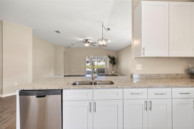 5131 Gato Del Sol Cir, Wesley Chapel, FL 33544 - kitchen with stainless steel dishwasher, a ceiling fan, white cabinetry, a peninsula, and light stone countertops