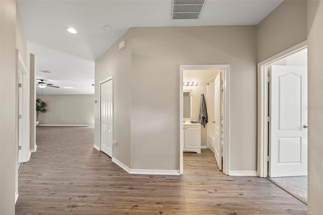 5131 Gato Del Sol Cir, Wesley Chapel, FL 33544 - hall with wood finished floors and recessed lighting