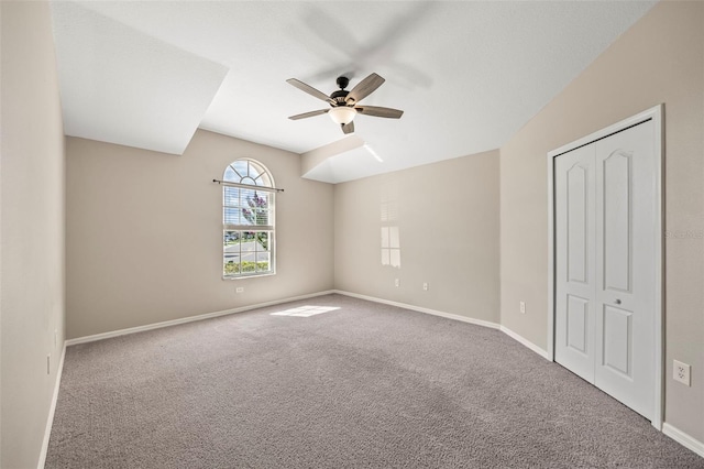 5131 Gato Del Sol Cir, Wesley Chapel, FL 33544 - unfurnished bedroom with carpet floors, a ceiling fan, and a closet