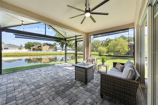 5131 Gato Del Sol Cir, Wesley Chapel, FL 33544 - sunroom / solarium with ceiling fan, a water view, an outdoor hangout area, vaulted ceiling, and healthy amount of natural light