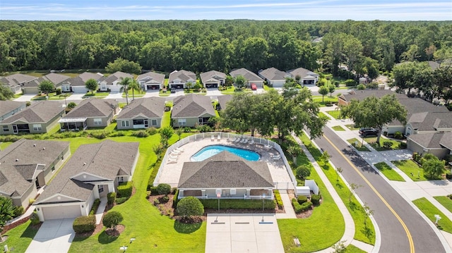 5131 Gato Del Sol Cir, Wesley Chapel, FL 33544 - aerial view of residential area with a pool and a heavily wooded area