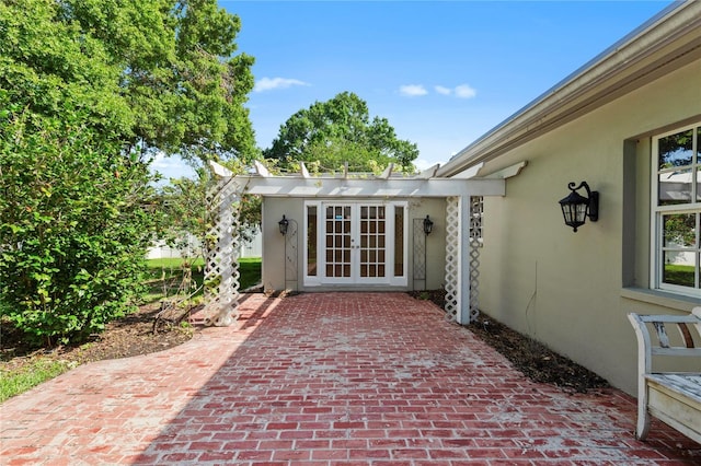 302 Eastleigh Dr, Belleair, FL 33756 - view of patio featuring french doors