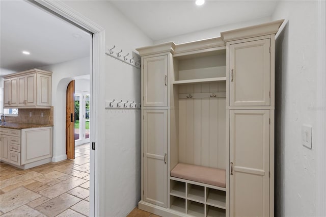 302 Eastleigh Dr, Belleair, FL 33756 - mudroom featuring arched walkways, recessed lighting, and stone tile floors