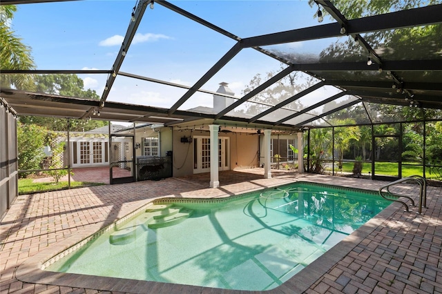 302 Eastleigh Dr, Belleair, FL 33756 - swimming pool with french doors, a patio, and a lanai
