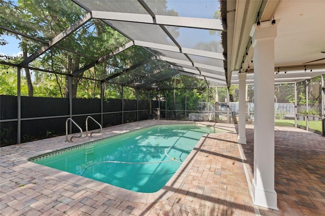302 Eastleigh Dr, Belleair, FL 33756 - view of swimming pool featuring a fenced backyard, a patio, and glass enclosure