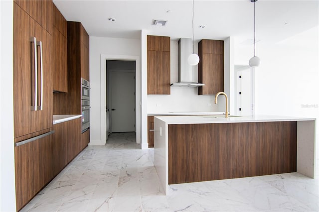 777 3rd Ave N Unit 1704, Saint Petersburg, FL 33701 - kitchen with modern cabinets, wall chimney range hood, light marble finish floors, light countertops, and paneled built in refrigerator