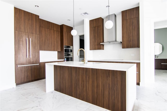 777 3rd Ave N Unit 1704, Saint Petersburg, FL 33701 - kitchen with modern cabinets, light marble finish floors, wall chimney exhaust hood, and light countertops