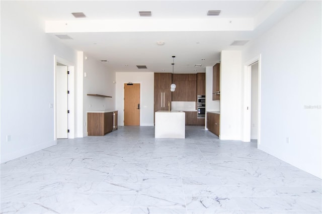 777 3rd Ave N Unit 1704, Saint Petersburg, FL 33701 - unfurnished living room featuring baseboards and light marble finish floors