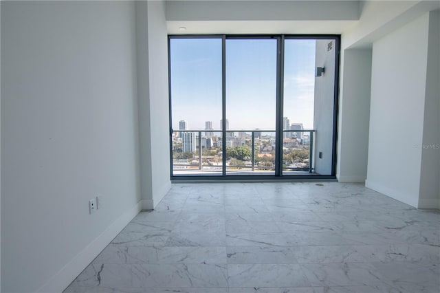 777 3rd Ave N Unit 1704, Saint Petersburg, FL 33701 - unfurnished room with marble look tiles and a view of city