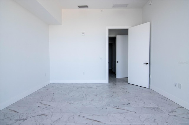 777 3rd Ave N Unit 1704, Saint Petersburg, FL 33701 - empty room featuring marble look tile flooring and baseboards