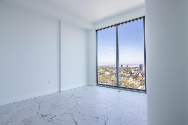 777 3rd Ave N Unit 1704, Saint Petersburg, FL 33701 - spare room with marble finish flooring and floor to ceiling windows