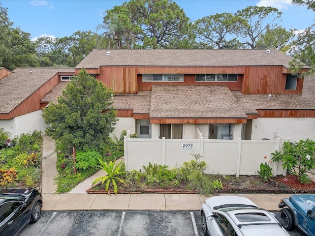 2078 Sunset Point Rd Unit 83, Clearwater, FL 33765 - view of building exterior with uncovered parking