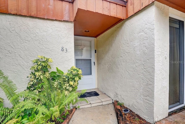 2078 Sunset Point Rd Unit 83, Clearwater, FL 33765 - property entrance featuring stucco siding