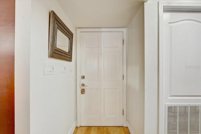 2078 Sunset Point Rd Unit 83, Clearwater, FL 33765 - entryway featuring light wood-style floors and baseboards