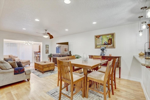 2078 Sunset Point Rd Unit 83, Clearwater, FL 33765 - dining room featuring light wood-style flooring, a textured ceiling, recessed lighting, and ceiling fan