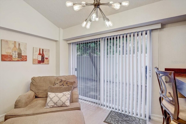 2078 Sunset Point Rd Unit 83, Clearwater, FL 33765 - living area with a chandelier and vaulted ceiling