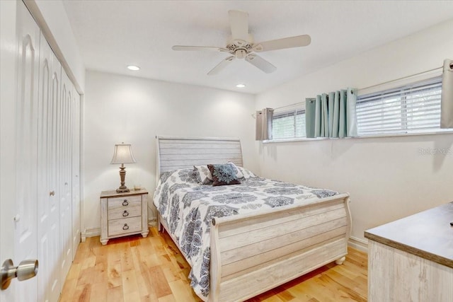 2078 Sunset Point Rd Unit 83, Clearwater, FL 33765 - bedroom with a closet, wood finished floors, recessed lighting, and a ceiling fan