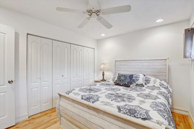 2078 Sunset Point Rd Unit 83, Clearwater, FL 33765 - bedroom featuring light wood-style floors, a closet, recessed lighting, and a ceiling fan