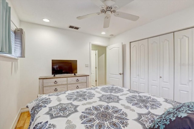 2078 Sunset Point Rd Unit 83, Clearwater, FL 33765 - bedroom with a closet, recessed lighting, wood finished floors, and ceiling fan