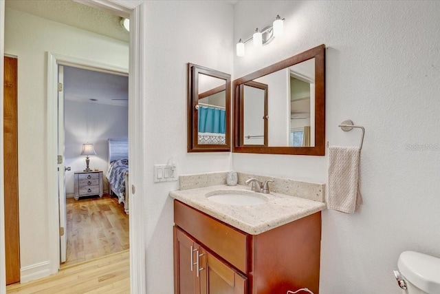 2078 Sunset Point Rd Unit 83, Clearwater, FL 33765 - full bath featuring vanity, wood finished floors, and ensuite bathroom
