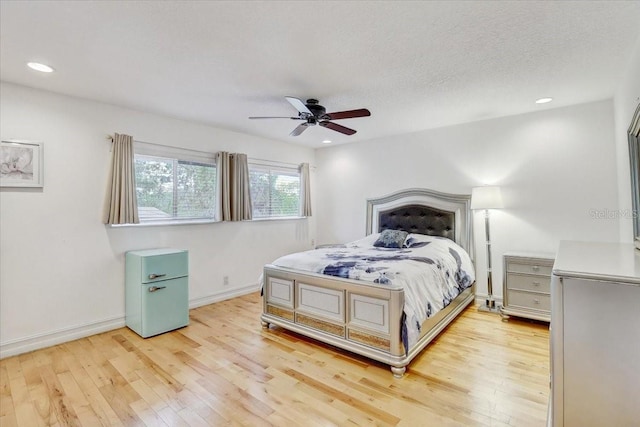 2078 Sunset Point Rd Unit 83, Clearwater, FL 33765 - bedroom featuring light wood finished floors, recessed lighting, and ceiling fan