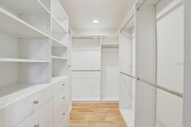 2078 Sunset Point Rd Unit 83, Clearwater, FL 33765 - walk in closet featuring light wood-style floors
