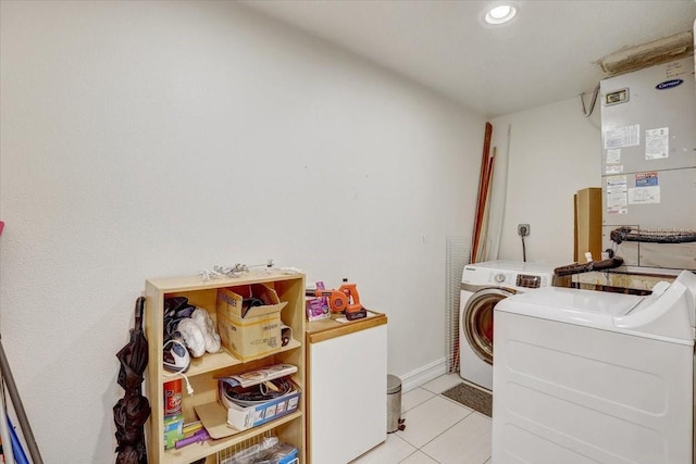 2078 Sunset Point Rd Unit 83, Clearwater, FL 33765 - washroom featuring washing machine and dryer, light tile patterned flooring, heating unit, and recessed lighting