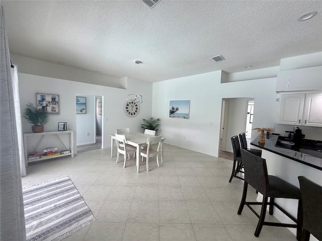 199 N Crystal Meadow Path, Lecanto, FL 34461 - dining room with a textured ceiling and light tile patterned flooring