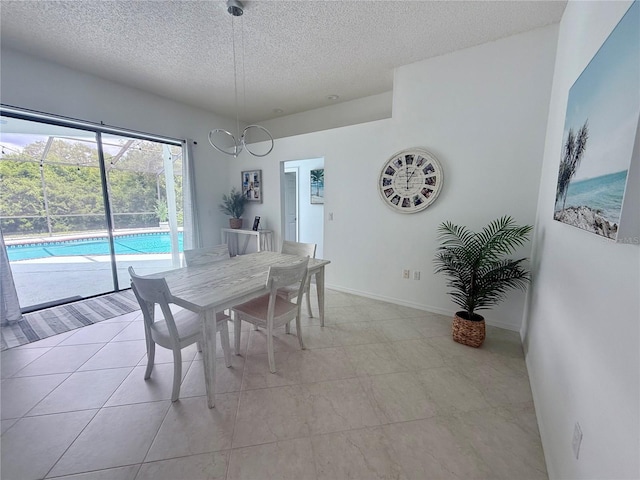 199 N Crystal Meadow Path, Lecanto, FL 34461 - dining room with a textured ceiling, a chandelier, and light tile patterned floors