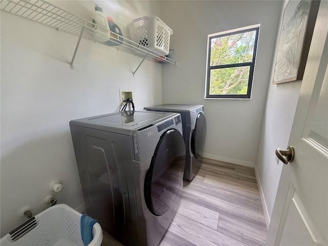 199 N Crystal Meadow Path, Lecanto, FL 34461 - laundry room with washer and clothes dryer and light wood-type flooring
