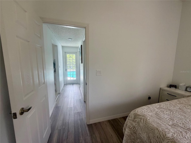 199 N Crystal Meadow Path, Lecanto, FL 34461 - bedroom featuring wood finished floors and a textured ceiling