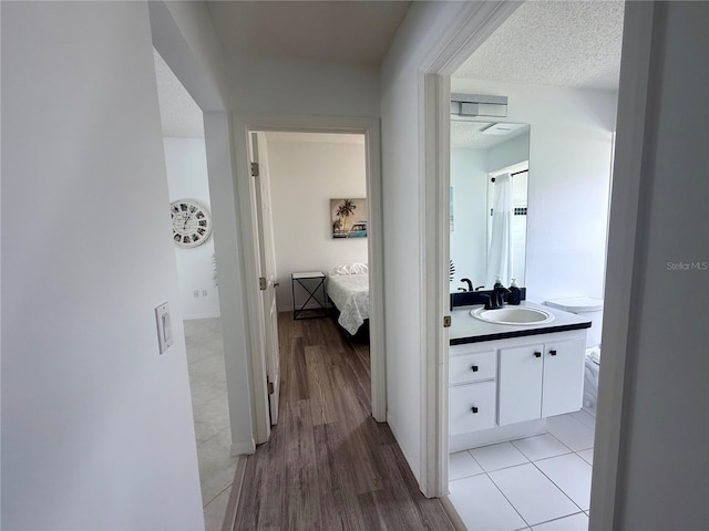 199 N Crystal Meadow Path, Lecanto, FL 34461 - corridor featuring light wood-type flooring and a textured ceiling