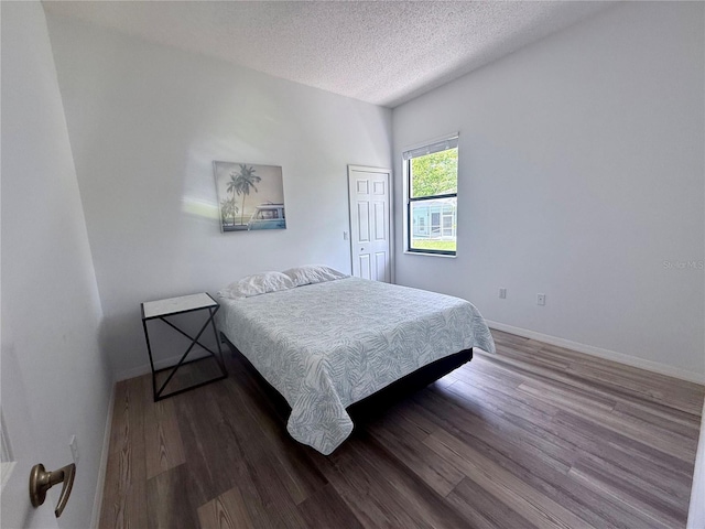 199 N Crystal Meadow Path, Lecanto, FL 34461 - bedroom with wood finished floors and a textured ceiling