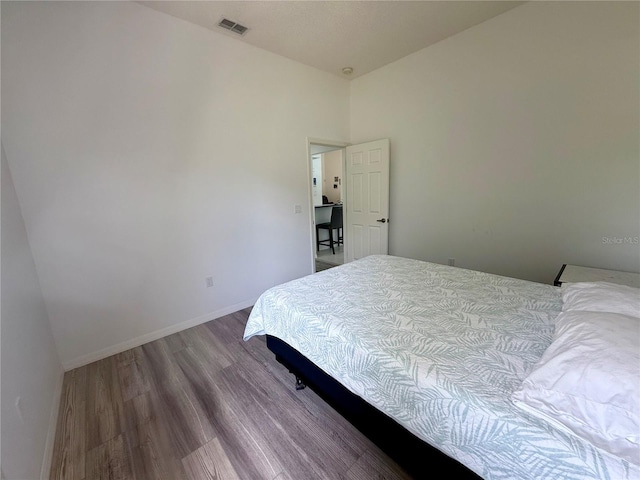 199 N Crystal Meadow Path, Lecanto, FL 34461 - bedroom with wood finished floors and baseboards