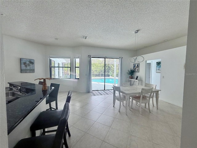 199 N Crystal Meadow Path, Lecanto, FL 34461 - dining room with a textured ceiling and light tile patterned flooring