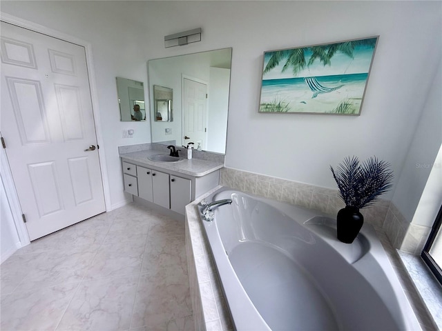 199 N Crystal Meadow Path, Lecanto, FL 34461 - bathroom featuring vanity, a garden tub, and marble look tile flooring
