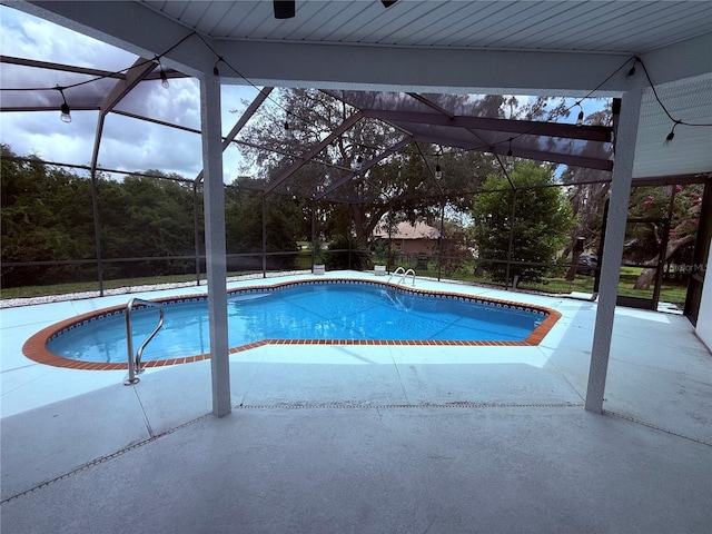 199 N Crystal Meadow Path, Lecanto, FL 34461 - swimming pool featuring glass enclosure and a patio