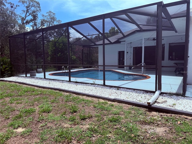 199 N Crystal Meadow Path, Lecanto, FL 34461 - outdoor pool featuring a patio area and glass enclosure