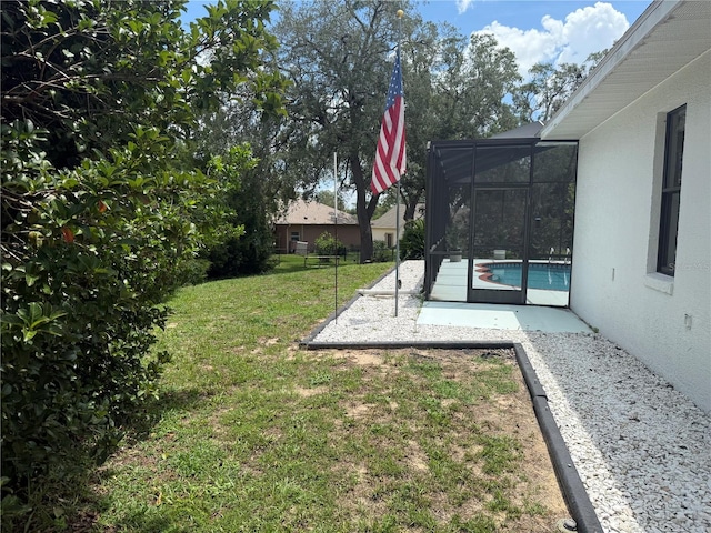 199 N Crystal Meadow Path, Lecanto, FL 34461 - view of grassy yard with an outdoor pool, a patio area, and a lanai