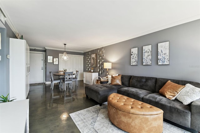255 Dolphin Pt Unit 207, Clearwater Beach, FL 33767 - living room with finished concrete flooring and crown molding