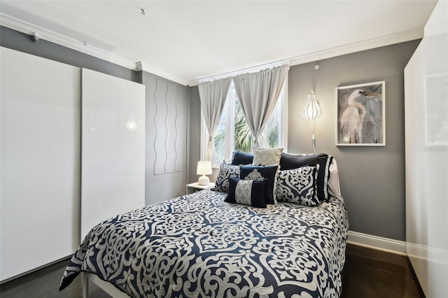 255 Dolphin Pt Unit 207, Clearwater Beach, FL 33767 - bedroom with ornamental molding and baseboards