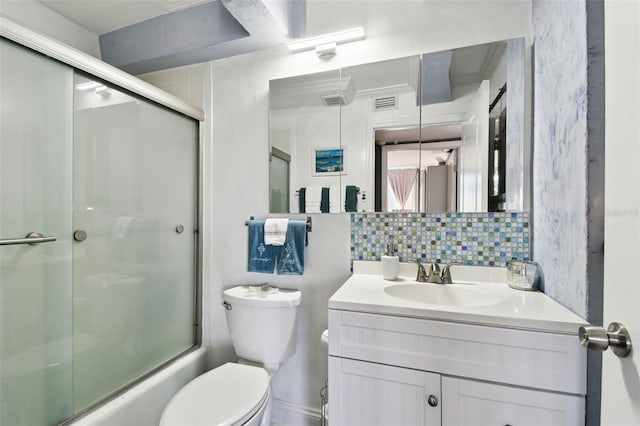 255 Dolphin Pt Unit 207, Clearwater Beach, FL 33767 - full bath with vanity, decorative backsplash, and shower / bath combination with glass door