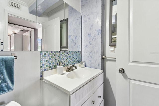 255 Dolphin Pt Unit 207, Clearwater Beach, FL 33767 - bathroom with vanity and decorative backsplash
