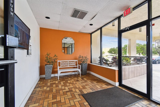 255 Dolphin Pt Unit 207, Clearwater Beach, FL 33767 - building lobby with a paneled ceiling