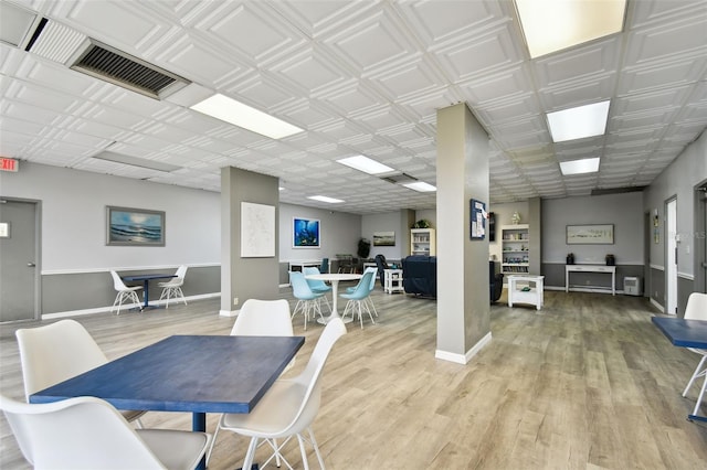 255 Dolphin Pt Unit 207, Clearwater Beach, FL 33767 - dining area featuring light wood-type flooring and baseboards
