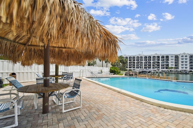 255 Dolphin Pt Unit 207, Clearwater Beach, FL 33767 - community pool featuring a patio